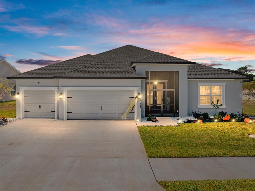 a front view of a house with a yard