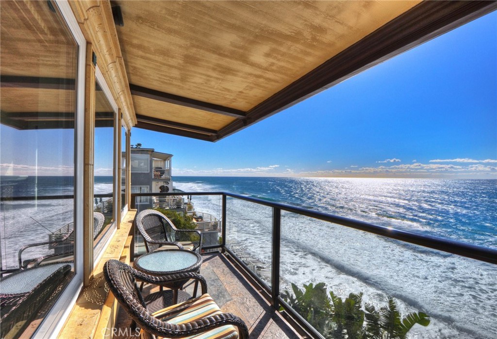 a view of a balcony with chairs