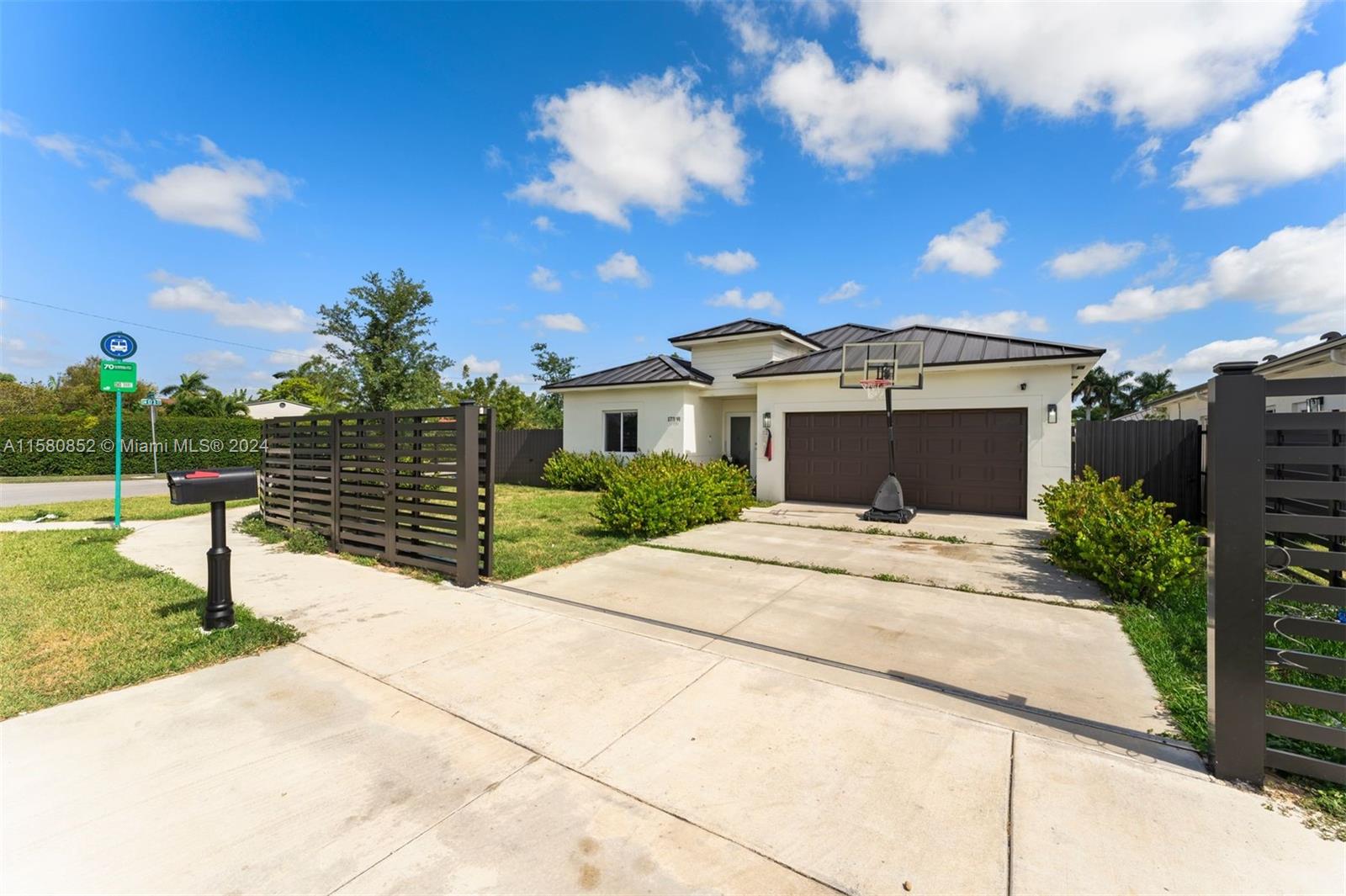 a view of house with yard and entertaining space