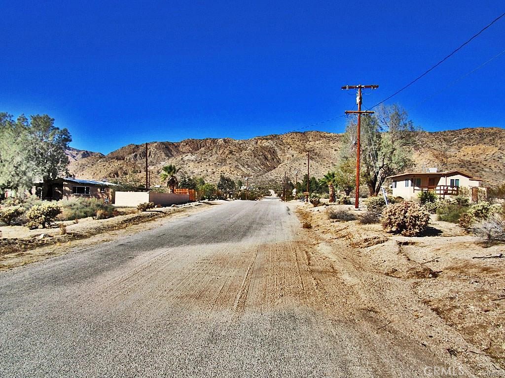 a view of a road with a building in the background