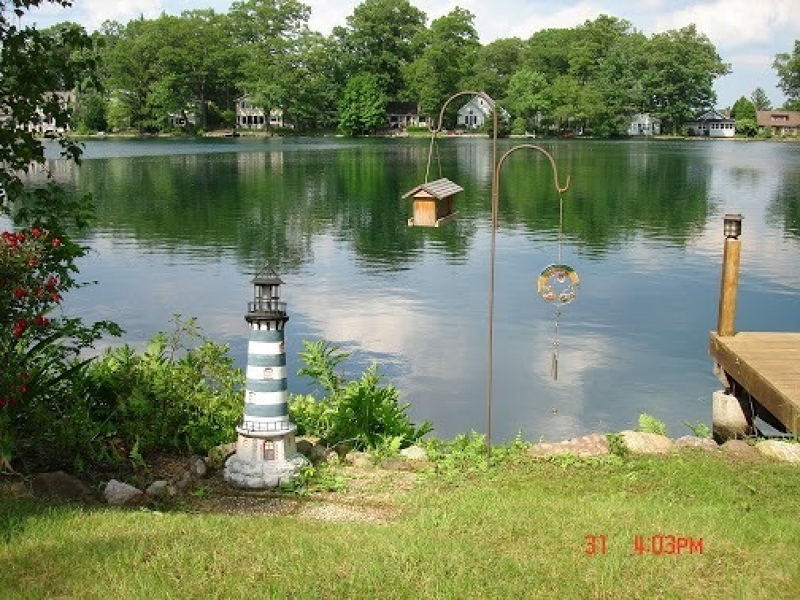 a view of a lake with a house in the background