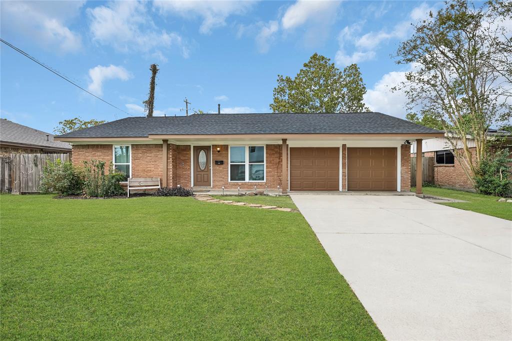 a view of a house with a backyard