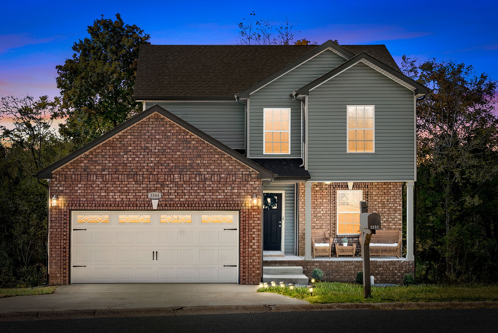 a front view of a house with a yard