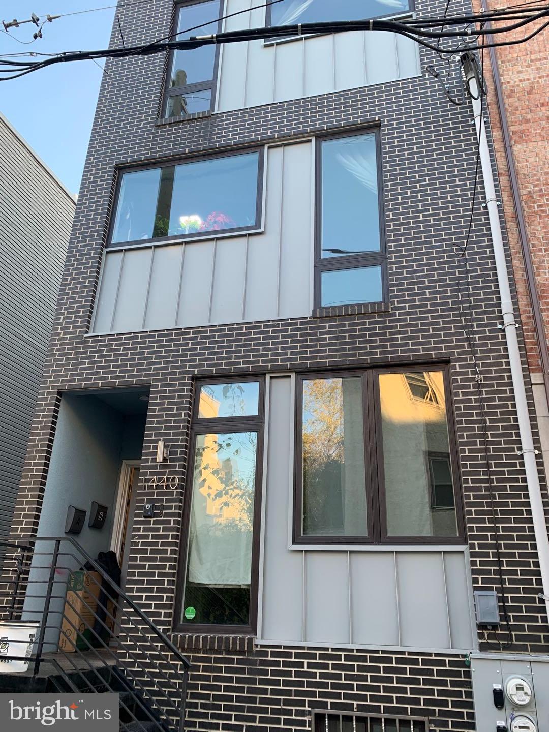 a view of a brick house with a window