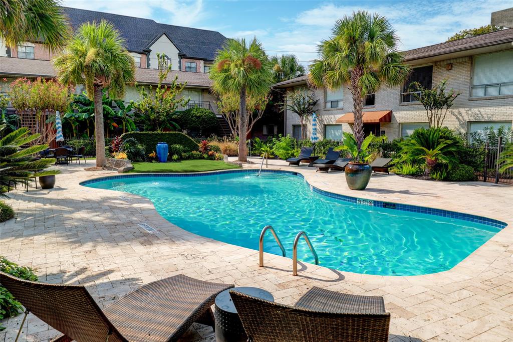 a view of a swimming pool with a patio