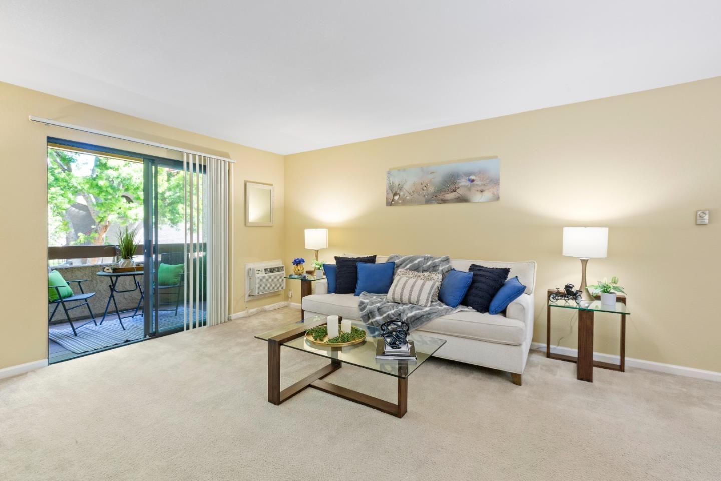 a living room with furniture and a lamp