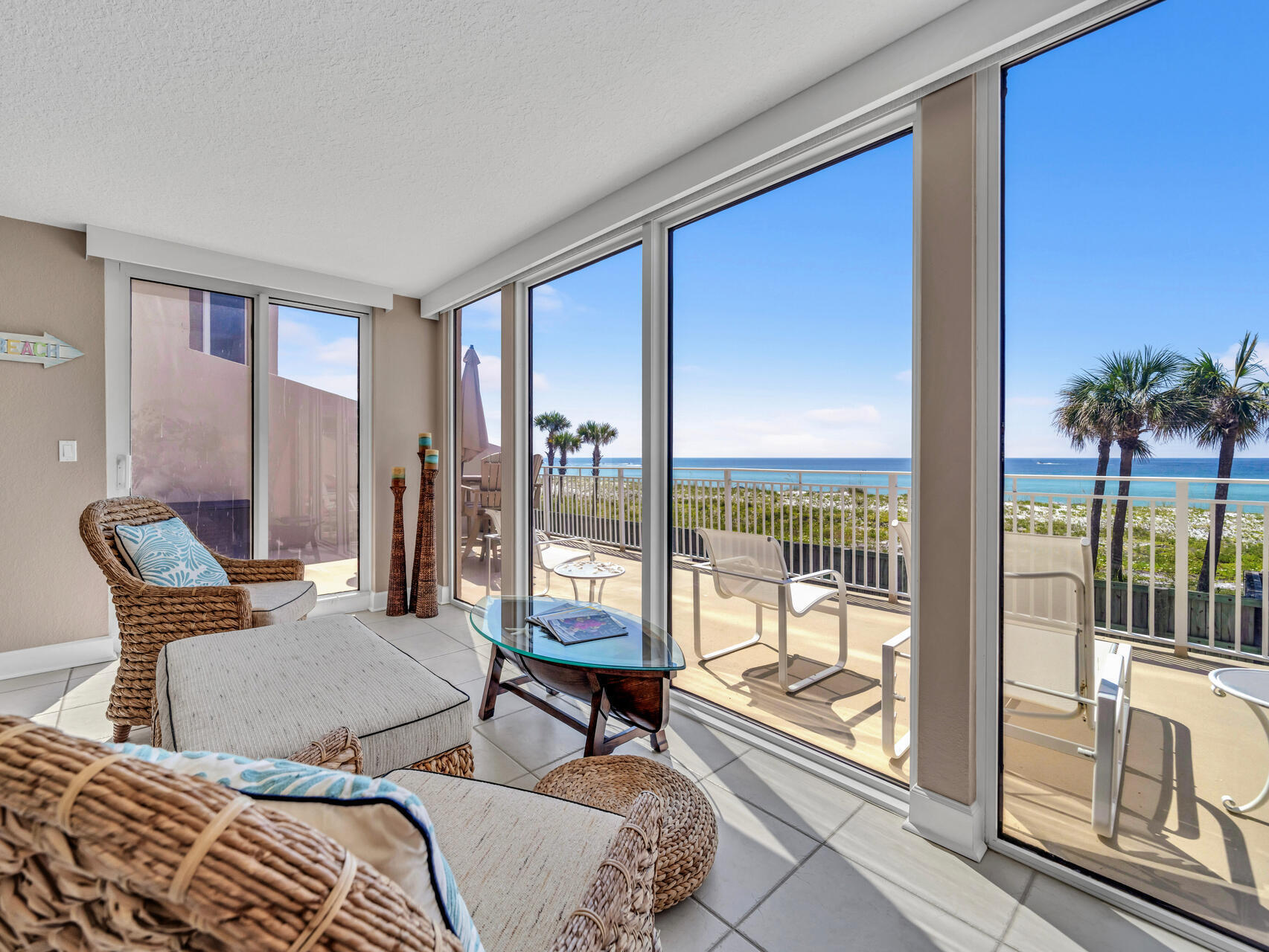 a outdoor living space with furniture and a floor to ceiling window