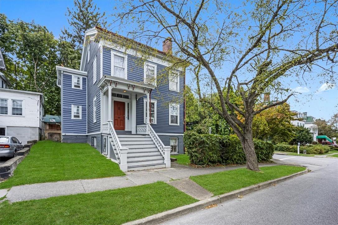 a front view of a house with a yard