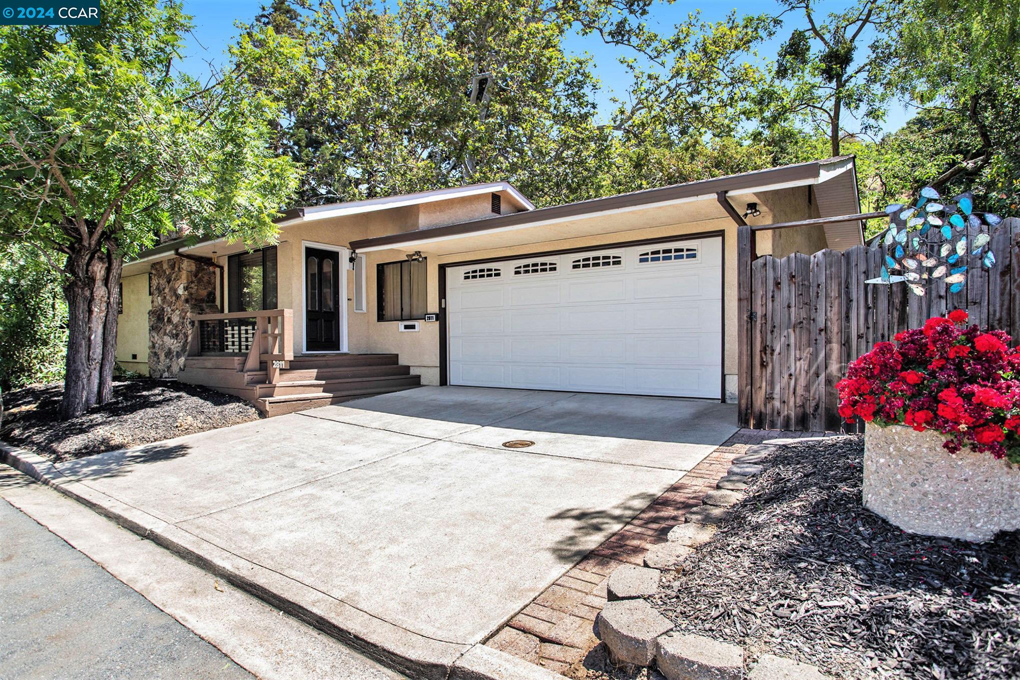 a front view of a house with a garage