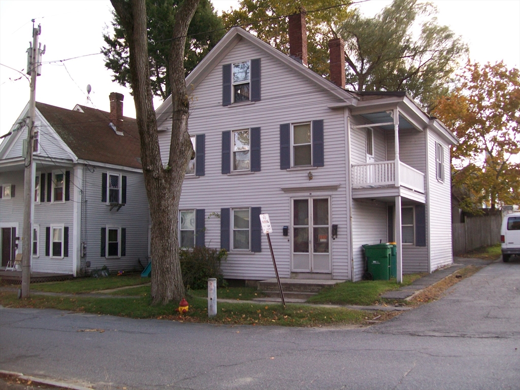 a view of a yard in front view of a house