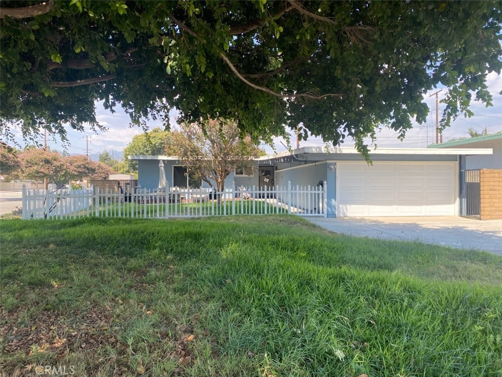 a view of a house with a yard balcony and sitting area