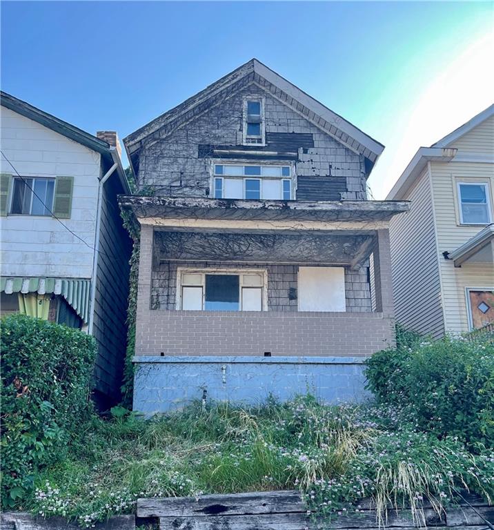 front view of a house with a small yard