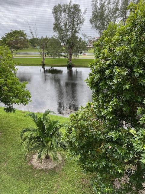 a view of a lake with a yard