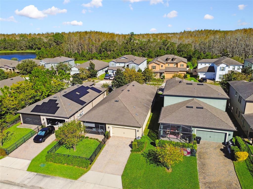 an aerial view of a house with a garden and plants