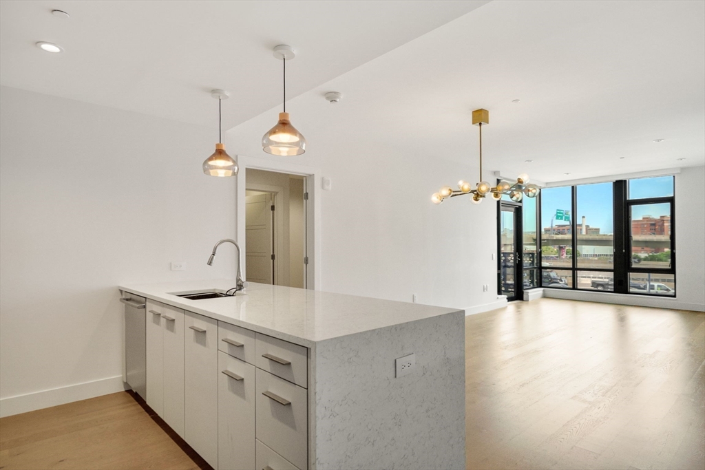 wooden floor in an empty room with a sink