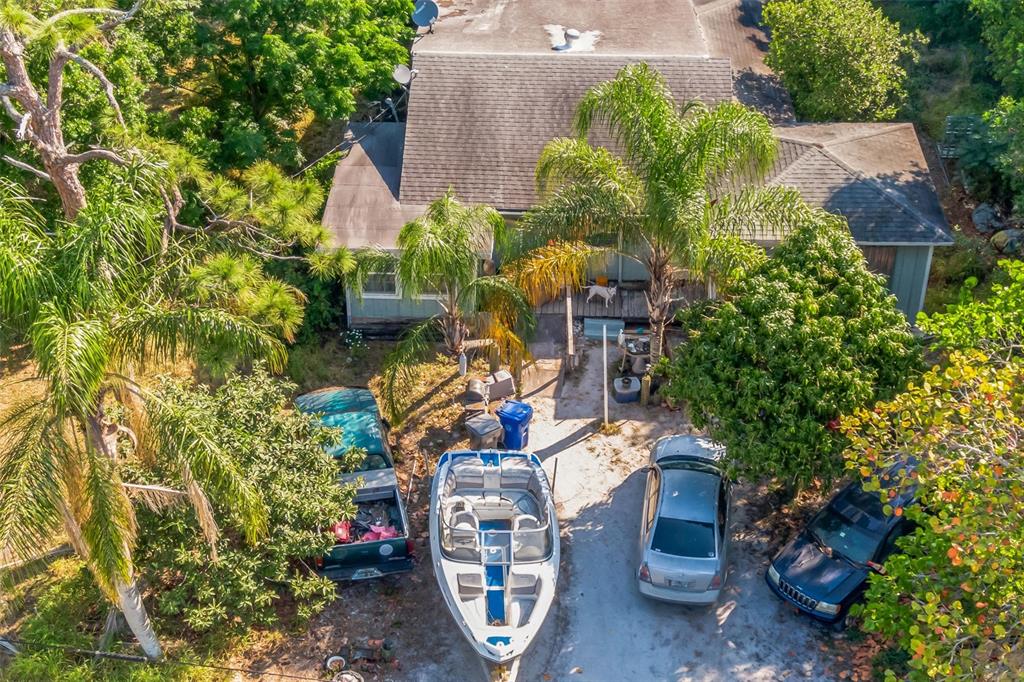 a aerial view of a house with a yard and garden