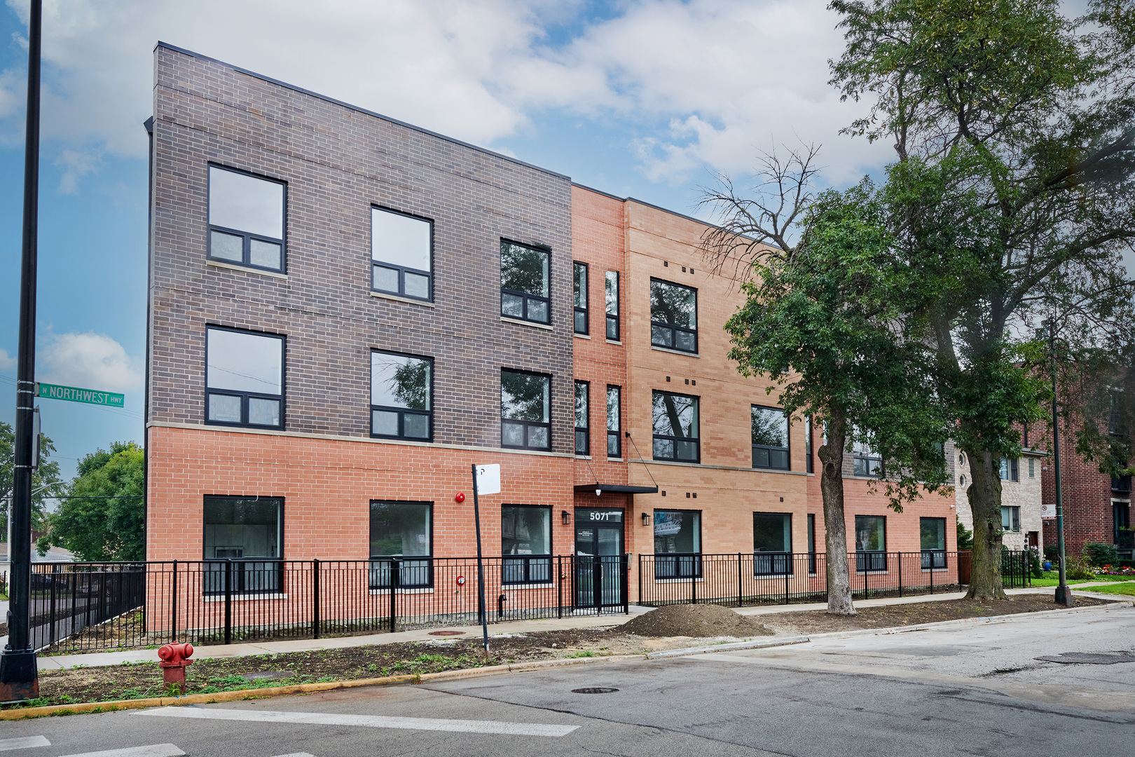 a front view of a building with street view