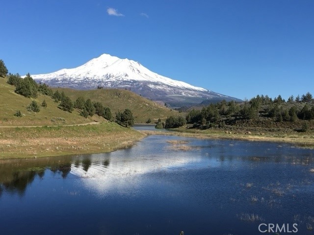 a view of a lake with mountains in the background