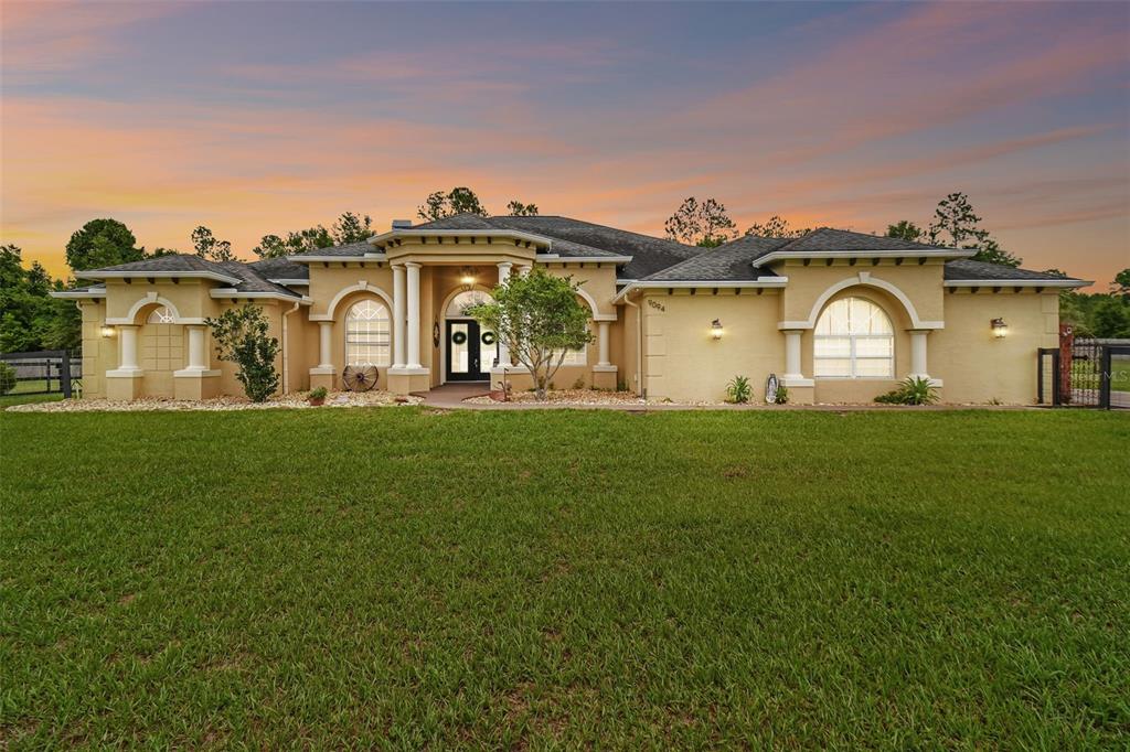 a front view of a house with a yard