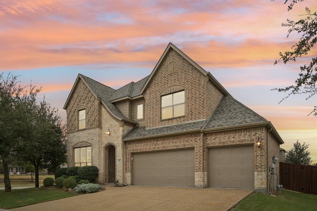 a front view of a house with a garage