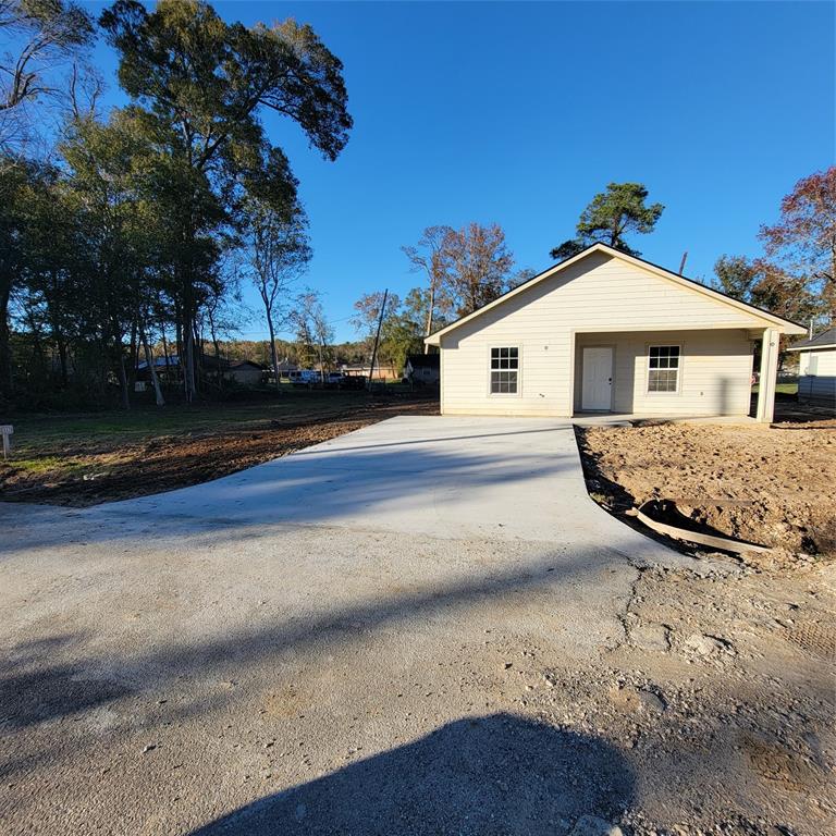 FRONT VIEW WITH HUGE SIDE YARD