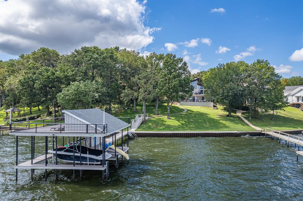 a small swimming pool is sitting in the middle of a lake