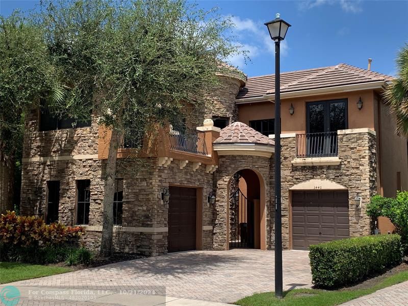 a front view of a house with yard