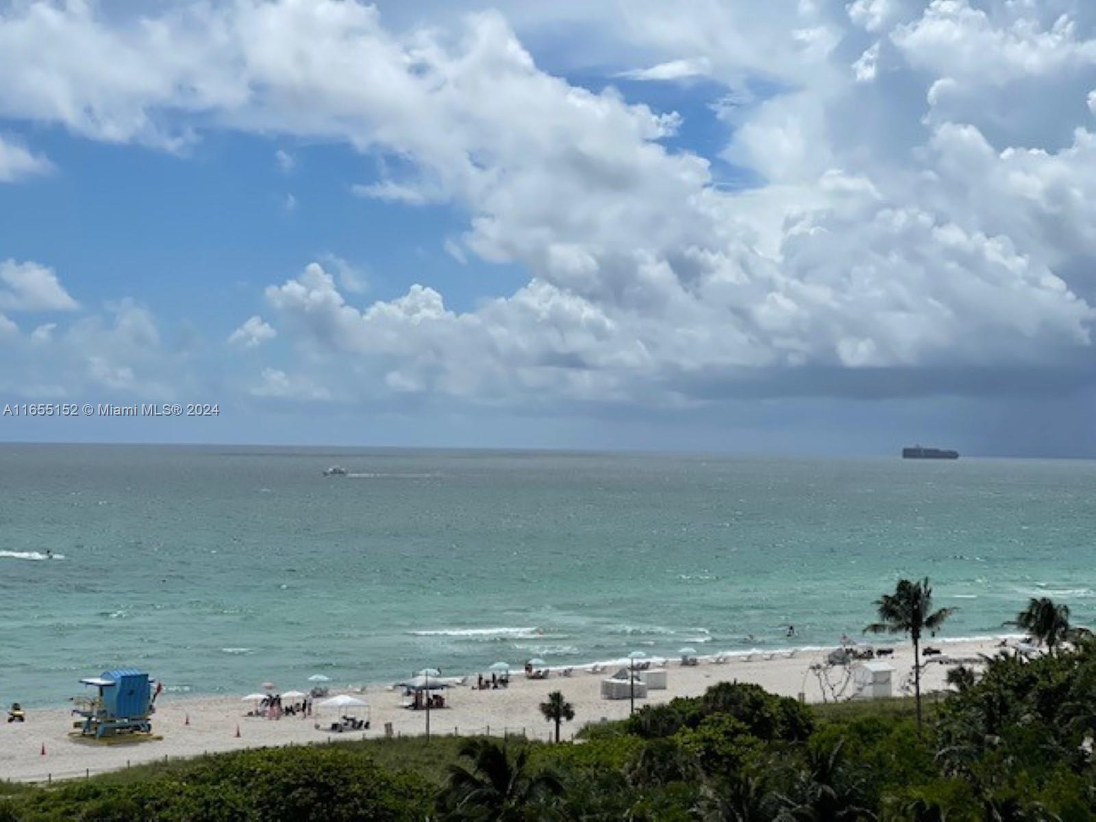 a view of a ocean with beach and ocean view