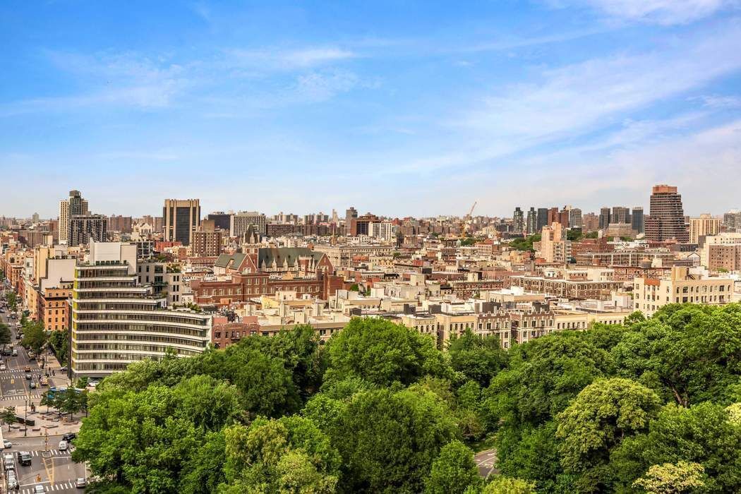 a view of a city with tall buildings in the background