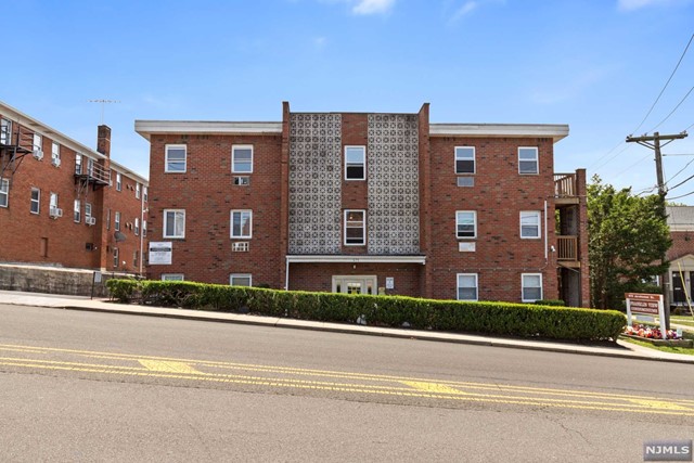 a view of a building next to a yard