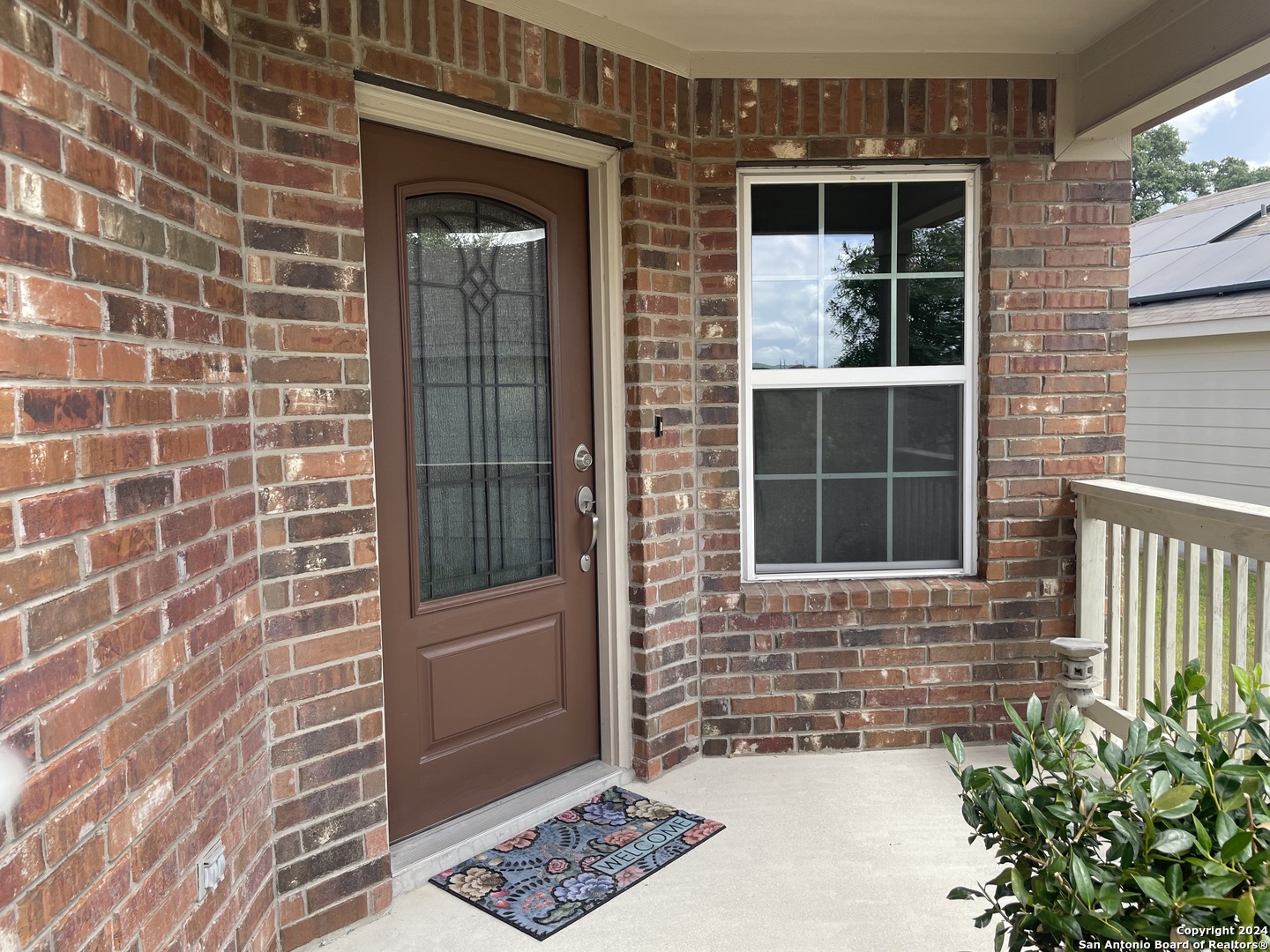 a view of a door and a window