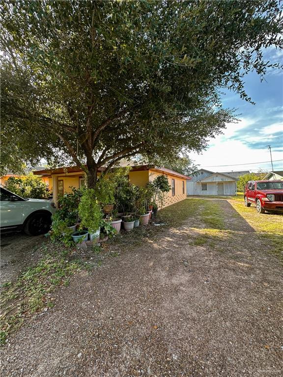 a view of a yard with car parked