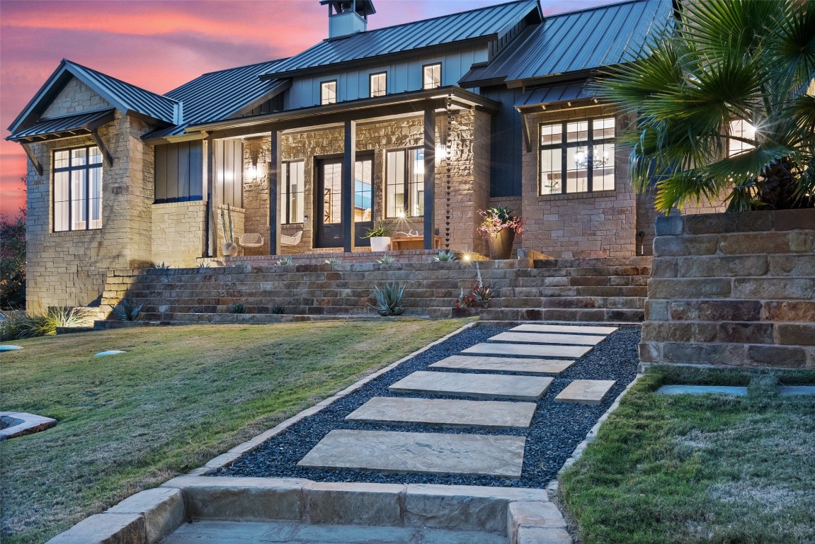 a front view of a house with garden