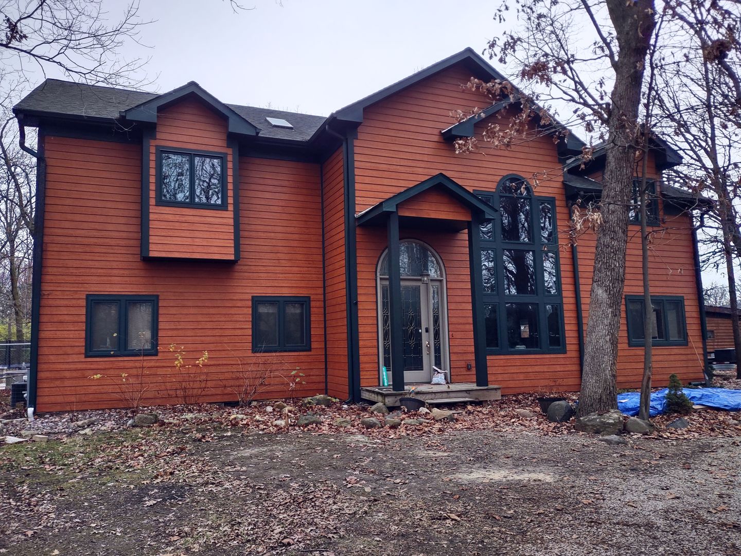 a front view of a house with glass windows