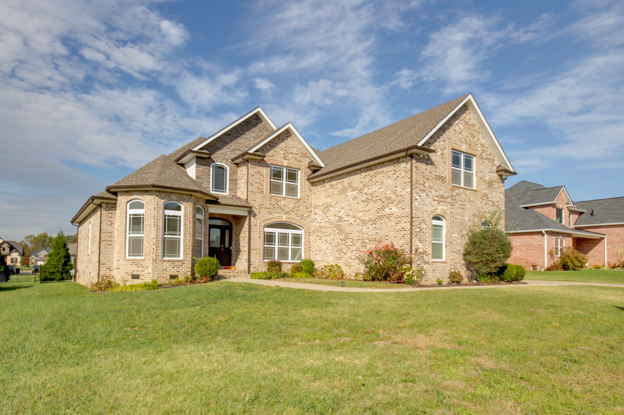 a front view of a house with a yard