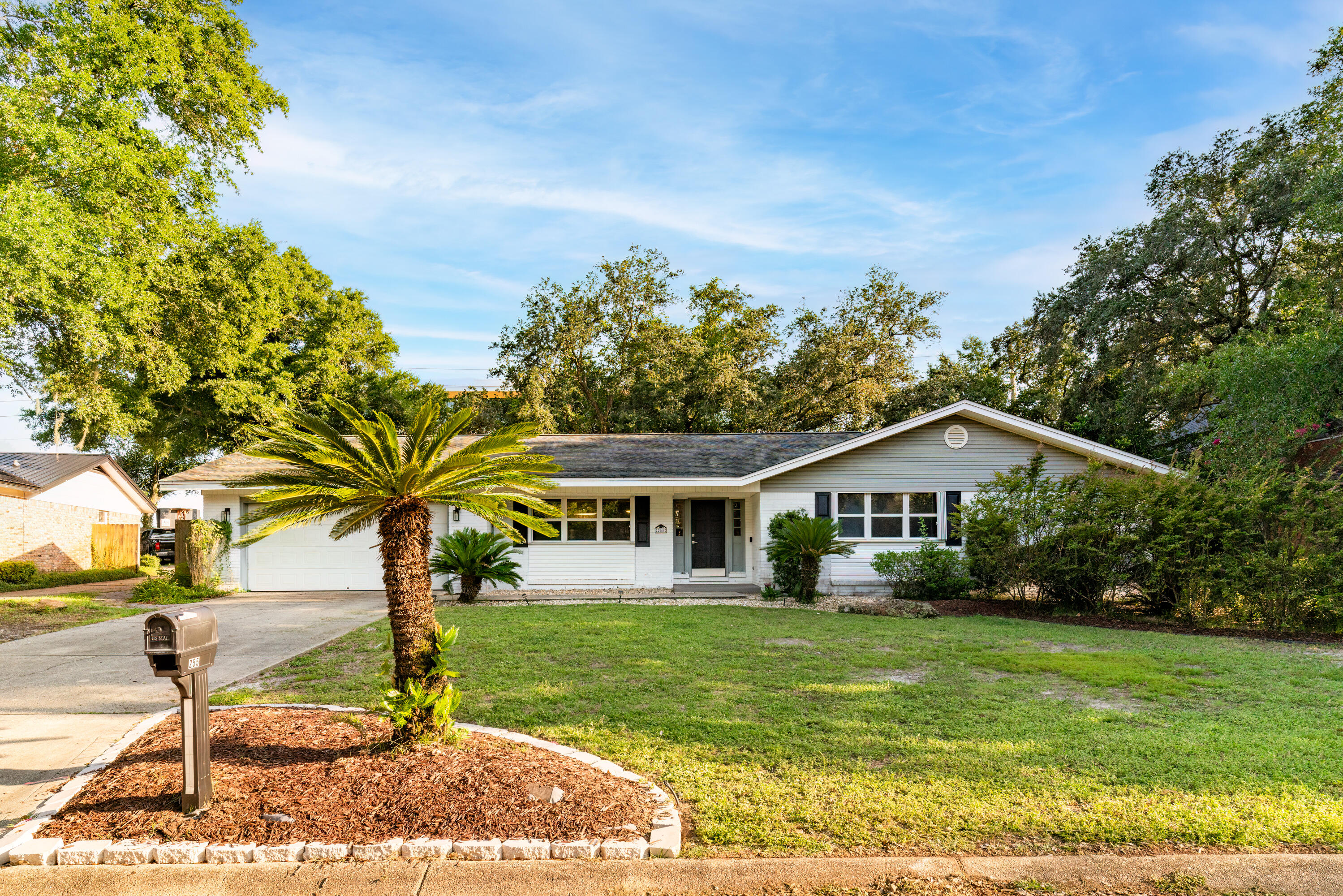 a front view of a house with garden