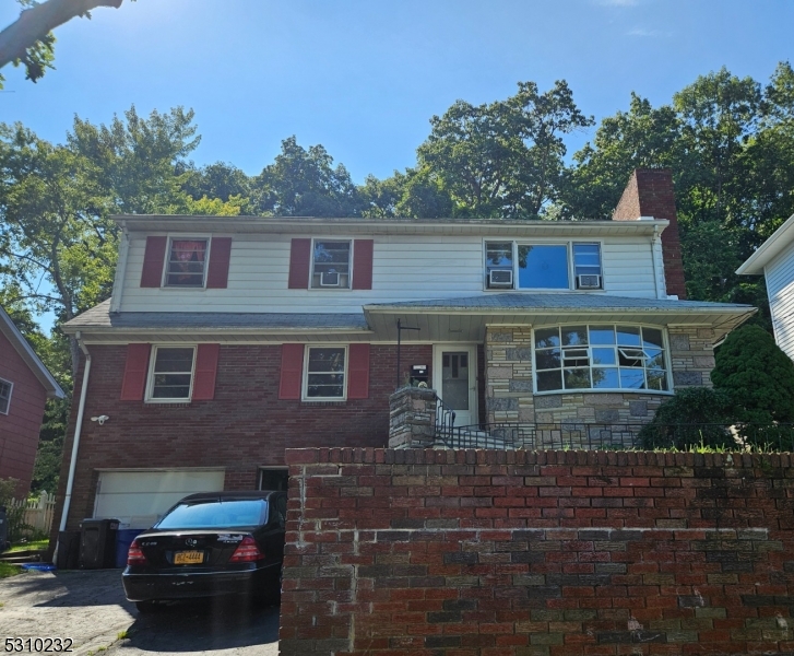 a front view of a house with yard