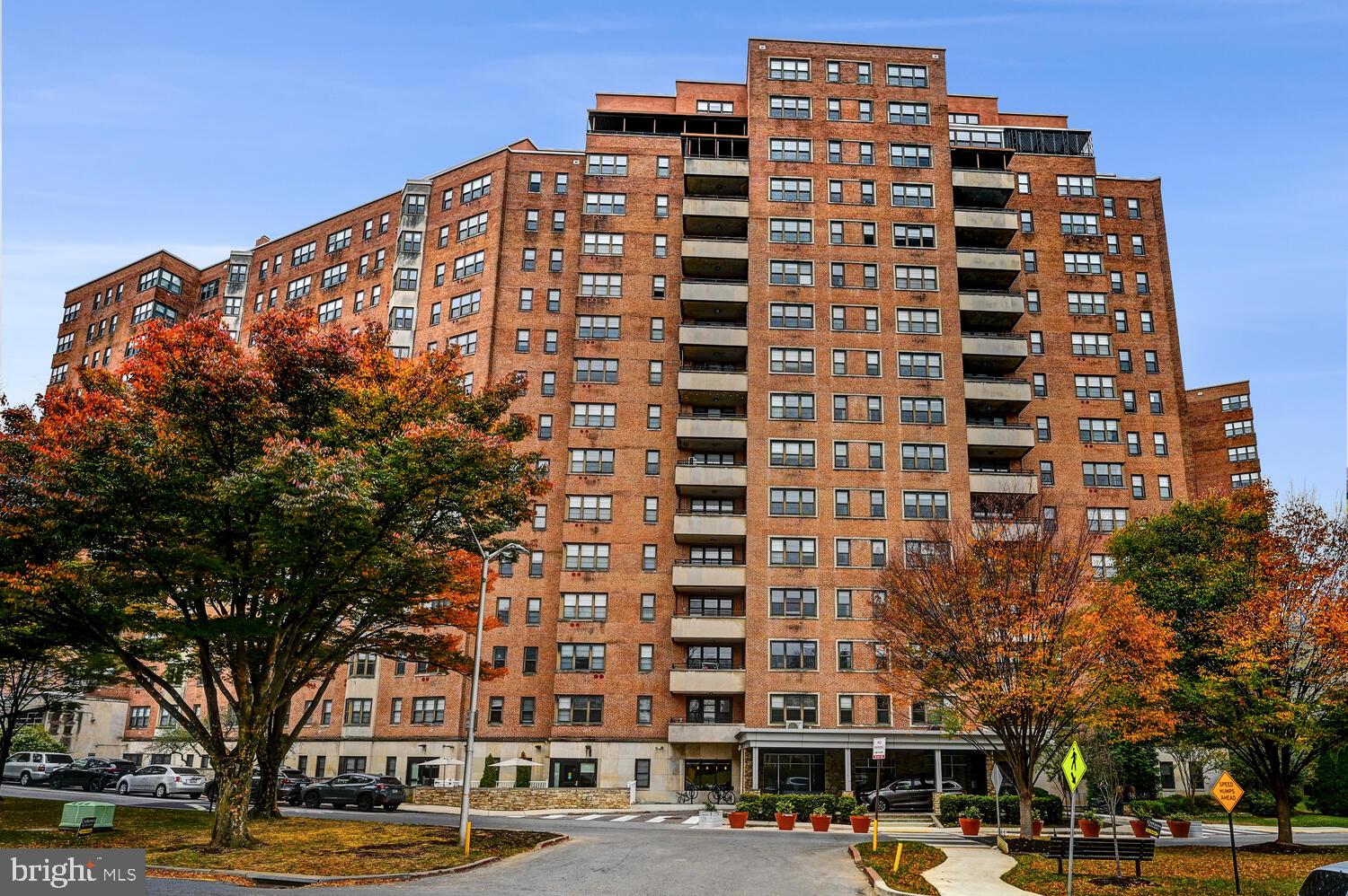 a front view of a building with parking space