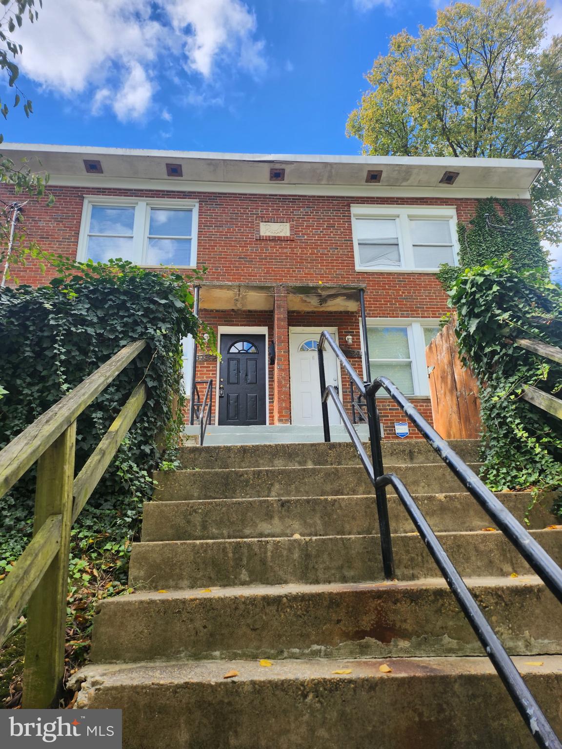 a front view of house with stairs