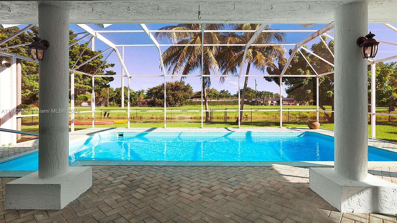 a view of a swimming pool with a lounge chairs