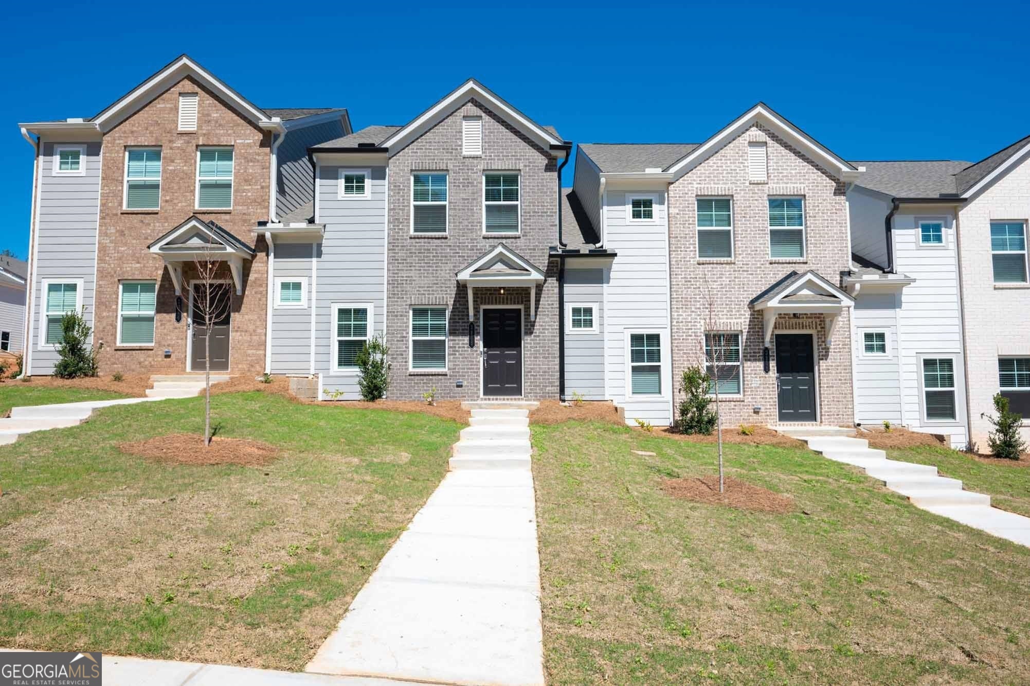 a front view of a house with a yard