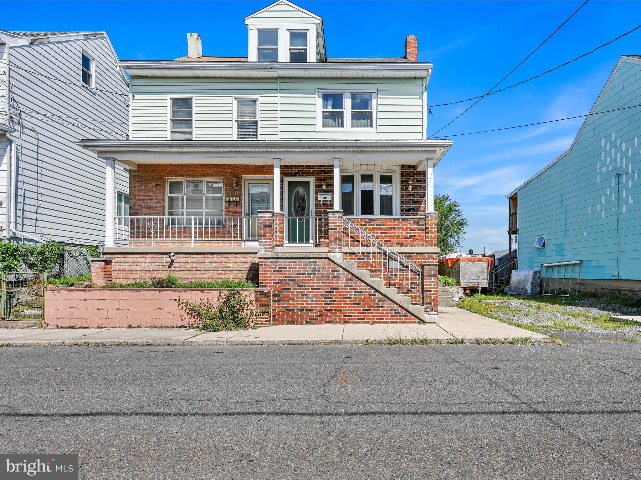 front view of house with a small yard