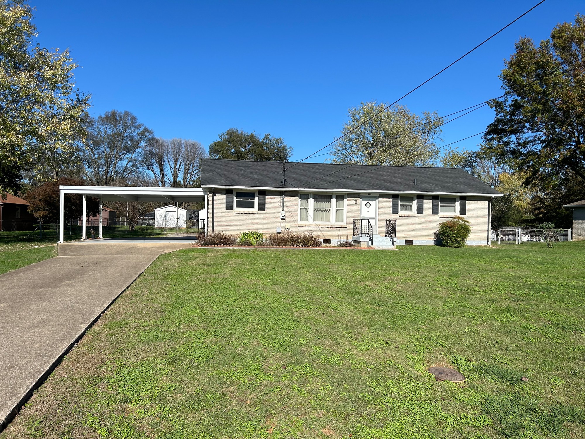 front view of a house with a yard