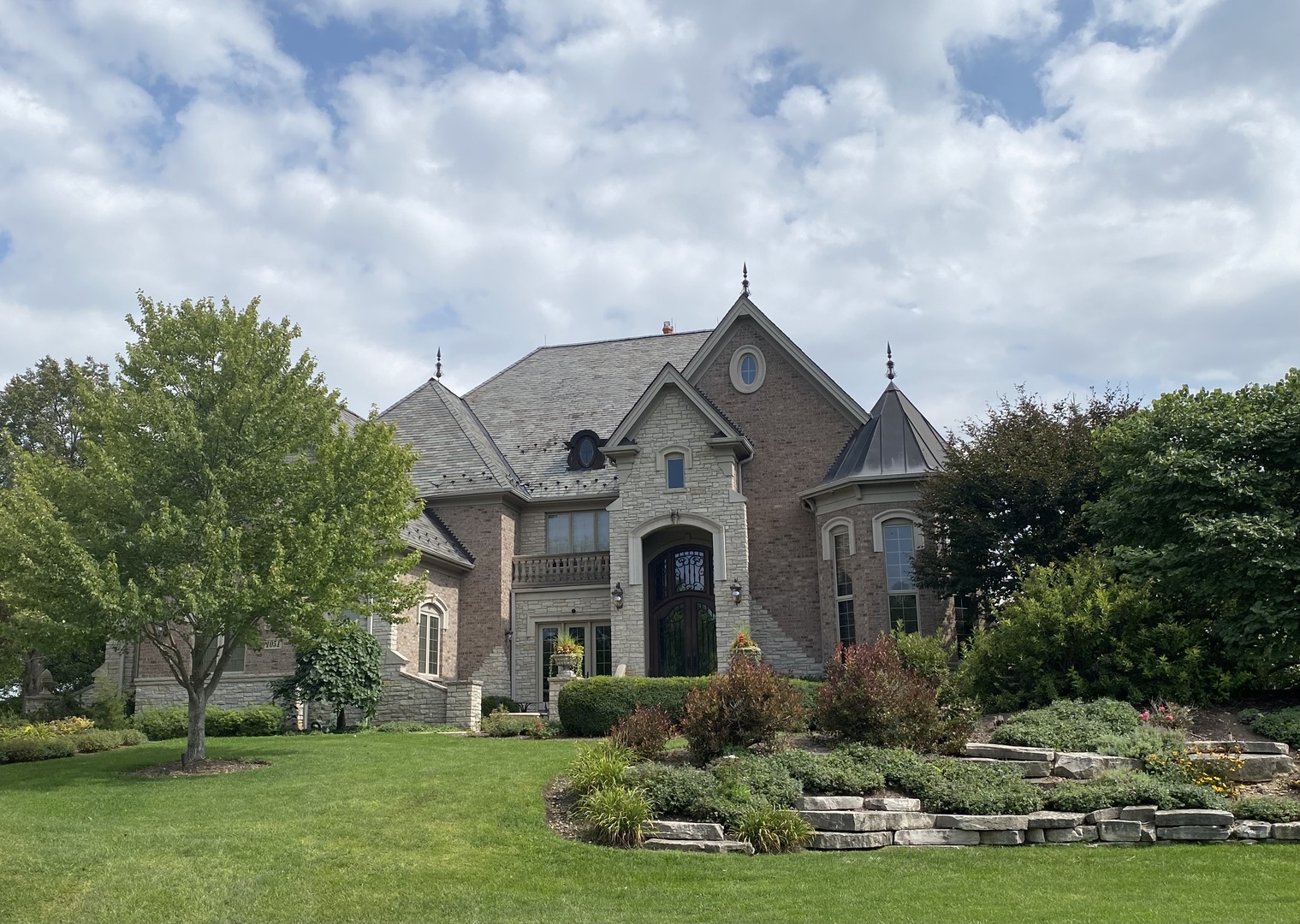 a front view of a house with a yard