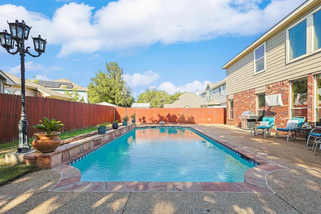 a view of a patio with swimming pool