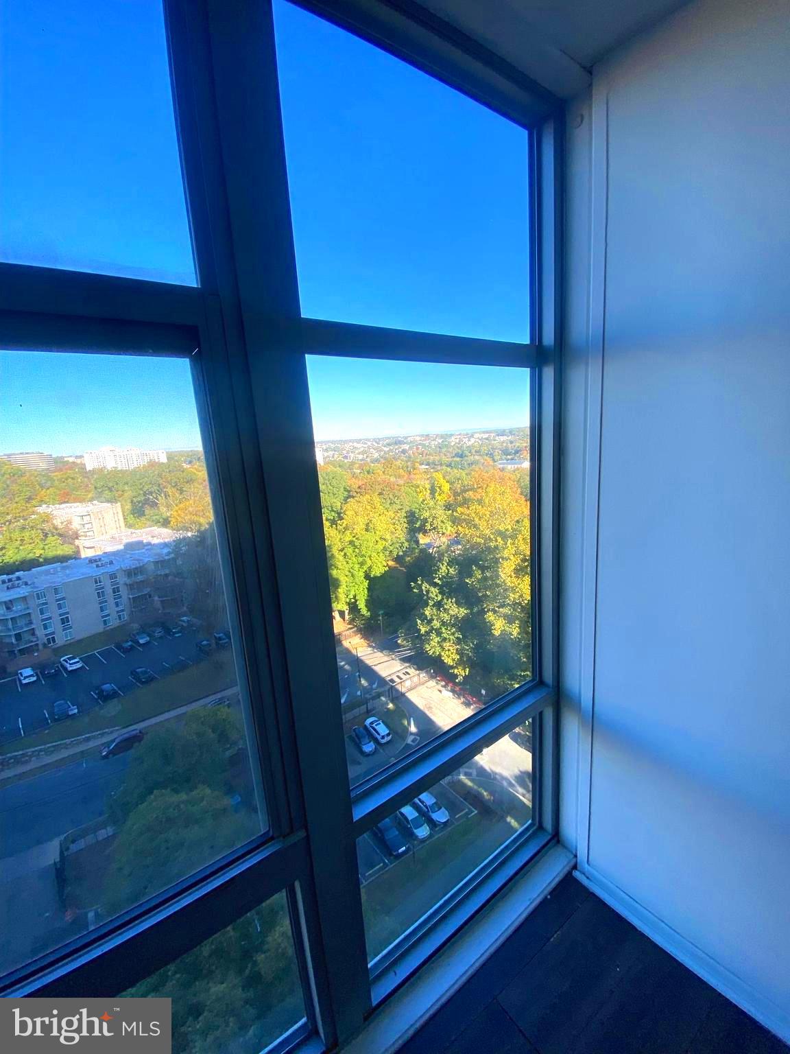 a view of an empty room and with a floor to ceiling window