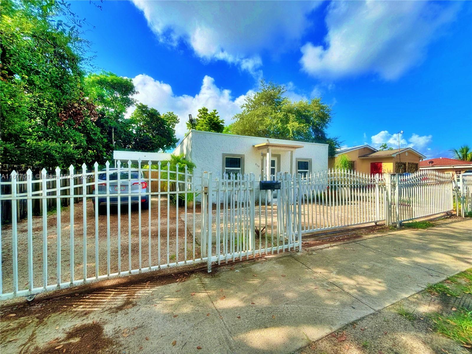 a view of a house with a fence