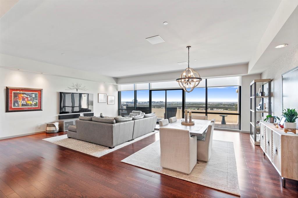 a living room with fireplace furniture and a wooden floor