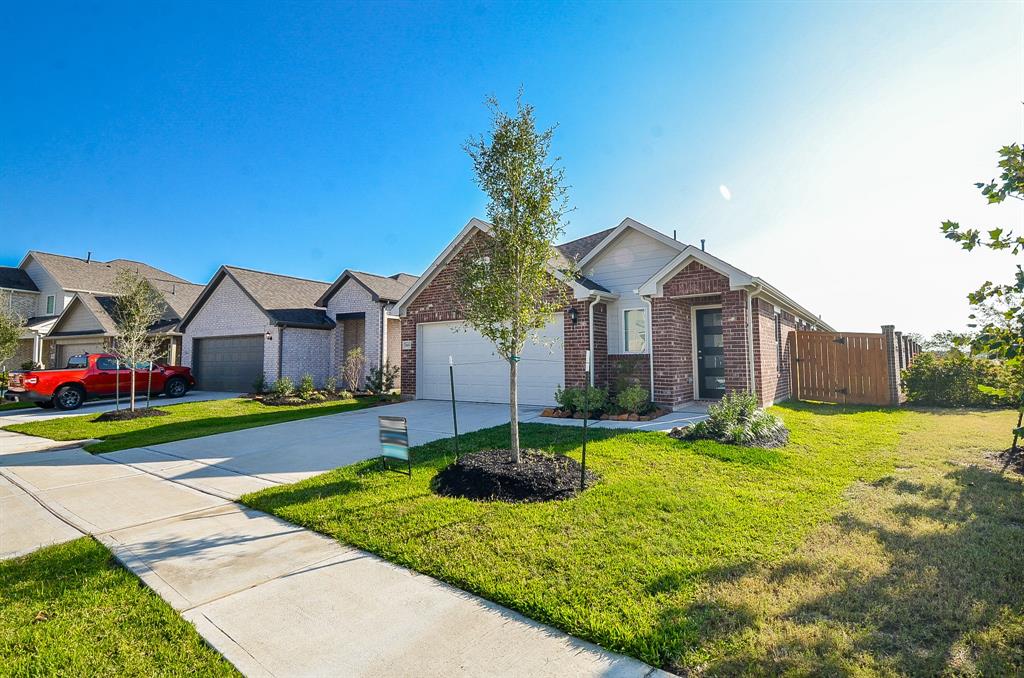 a front view of house with yard and green space