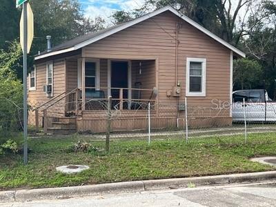 a view of house with backyard